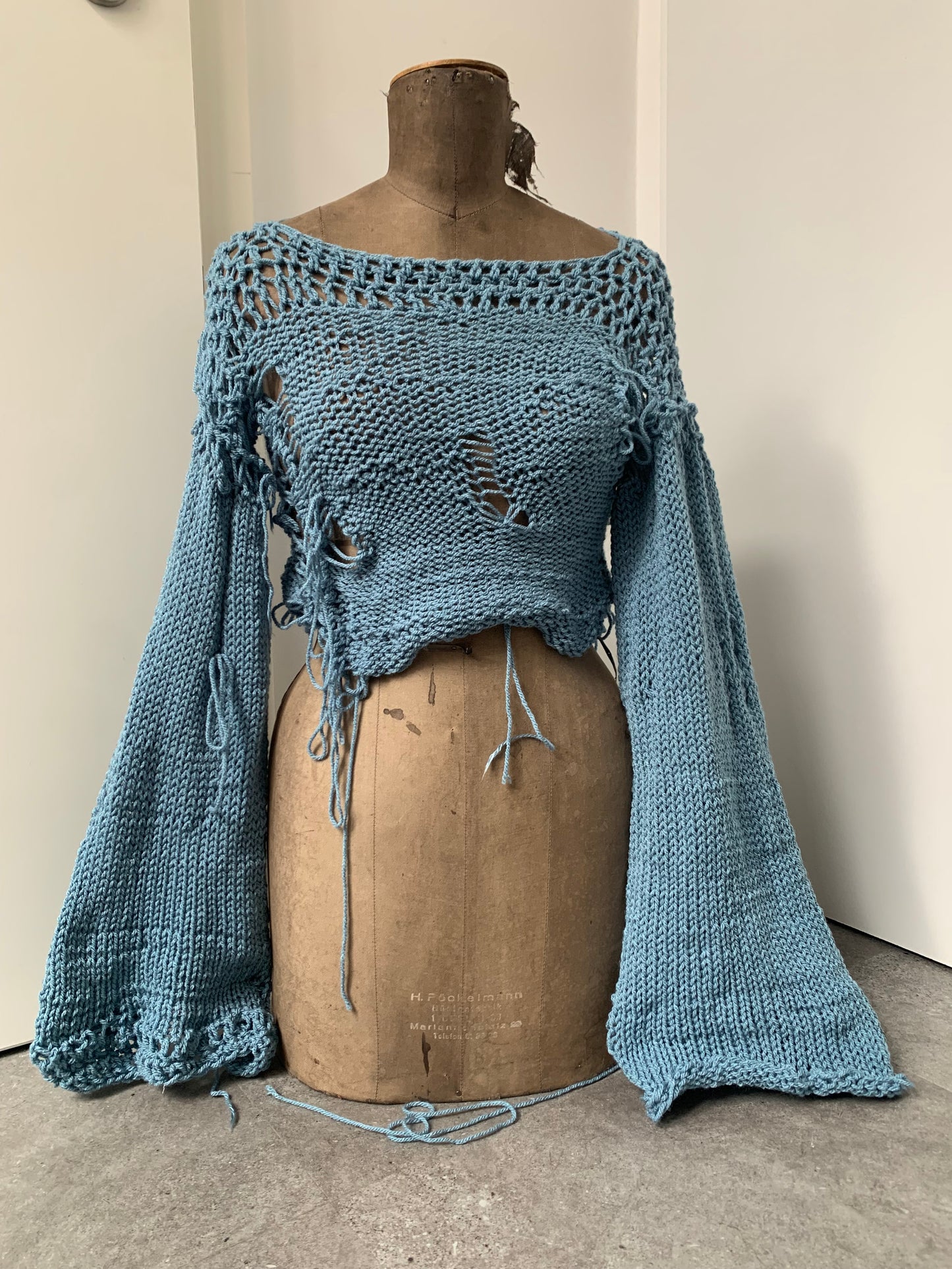 distressed blue sweater