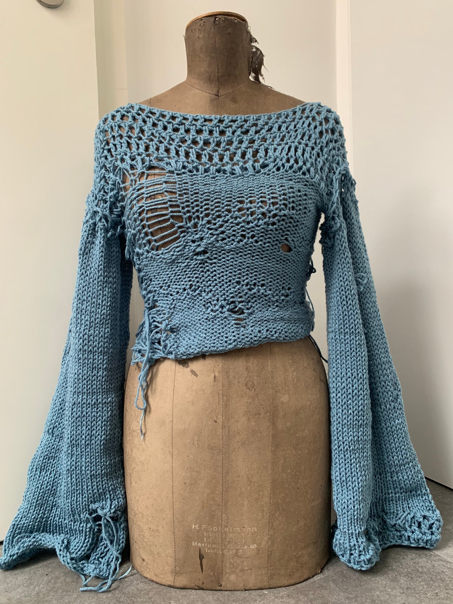 distressed blue sweater